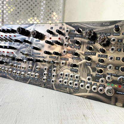 Angled front view of Maneco Labs Dark System M1 Module on wooden surface
