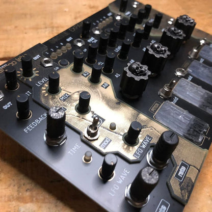 Angled close up view of Maneco Labs Grone Expander Module on wooden surface