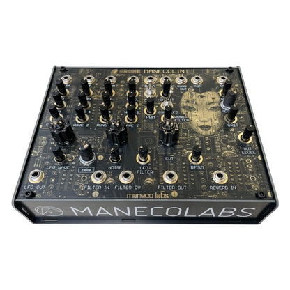 Angled front view of Maneco Labs Manecolin Table Top Synth on white background