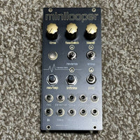 Front view of Maneco Labs Minilooper Module on beige carpet