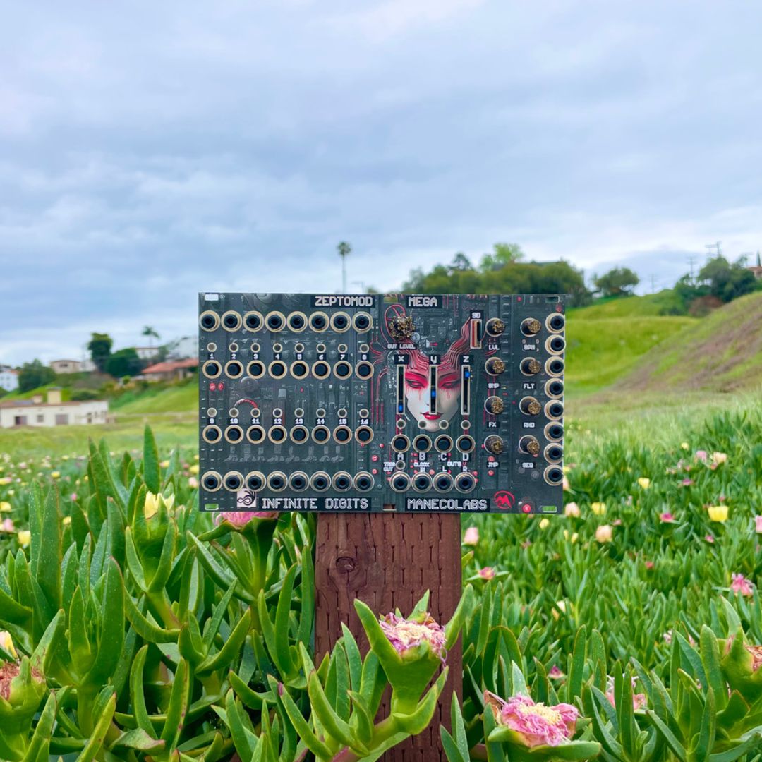 Front view of Maneco Labs Zeptomod Mega Module on stump outdoors