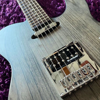 Close-up of a guitar with a Rockfield bridge on a purple textured background