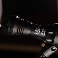 Close up of Milab Microphone on shock mount with dark background