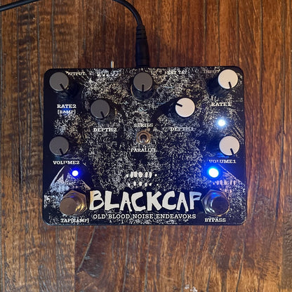 OBNE Blackcap Pedal On a Wooden Surface