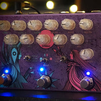 Close-up of a purple guitar effects pedal with various knobs and lights.