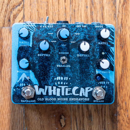 OBNE Whitecap Pedal On a Wooden Surface