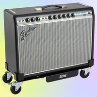 Angled view of On-Stage Amp Glider with amplifier mounted on multicolored background