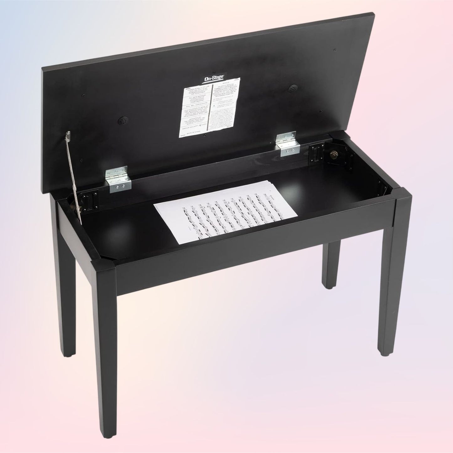 Angled view of On-Stage Deluxe Keyboard/Piano Bench with lid open on pink and purple background