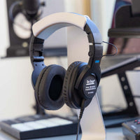 Angled view of On-Stage Professional Studio Headphones hanging on stand in studio