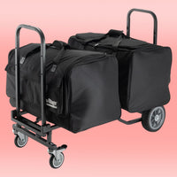 Angled view of On-Stage Utility Cart with bags mounted on pink background