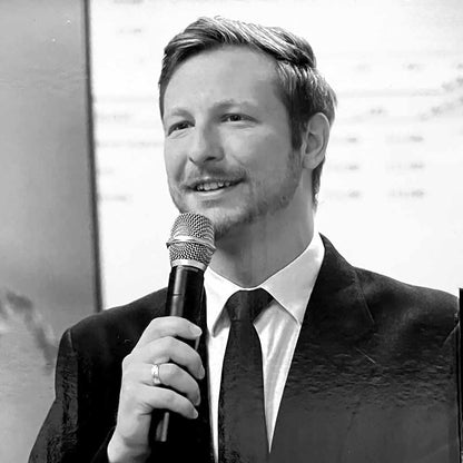 Man in suit using the PROformance PDW-700HH Dual Handheld Digital Wireless Mic System in conference