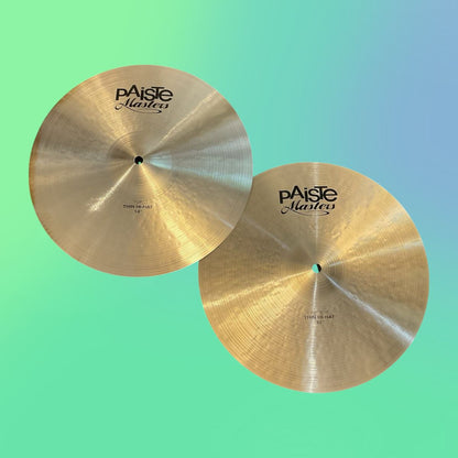 Front view of Paiste 14" Masters Thin Hi-Hats on green and blue gradient background