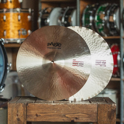 Front view of Paiste 15" 602 Sound Edge Hi-Hats on wooden crate in studio