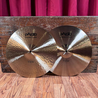 Front view of Paiste 15" Formula 602 Modern Essentials Hi-Hats leaning on wooden crate in studio