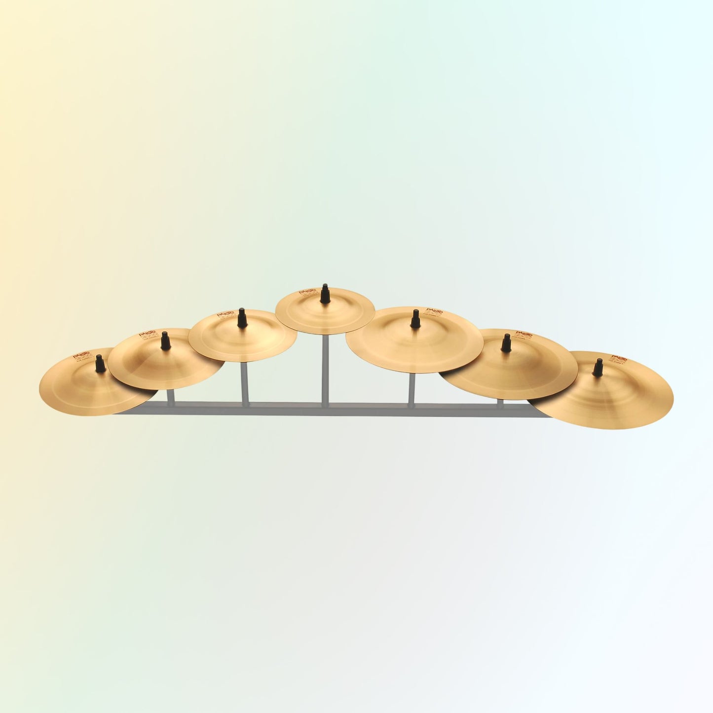 Inclusions of Paiste 2002 Cup Chime 7 Pc Set #1 - #7 on yellow and green gradient background