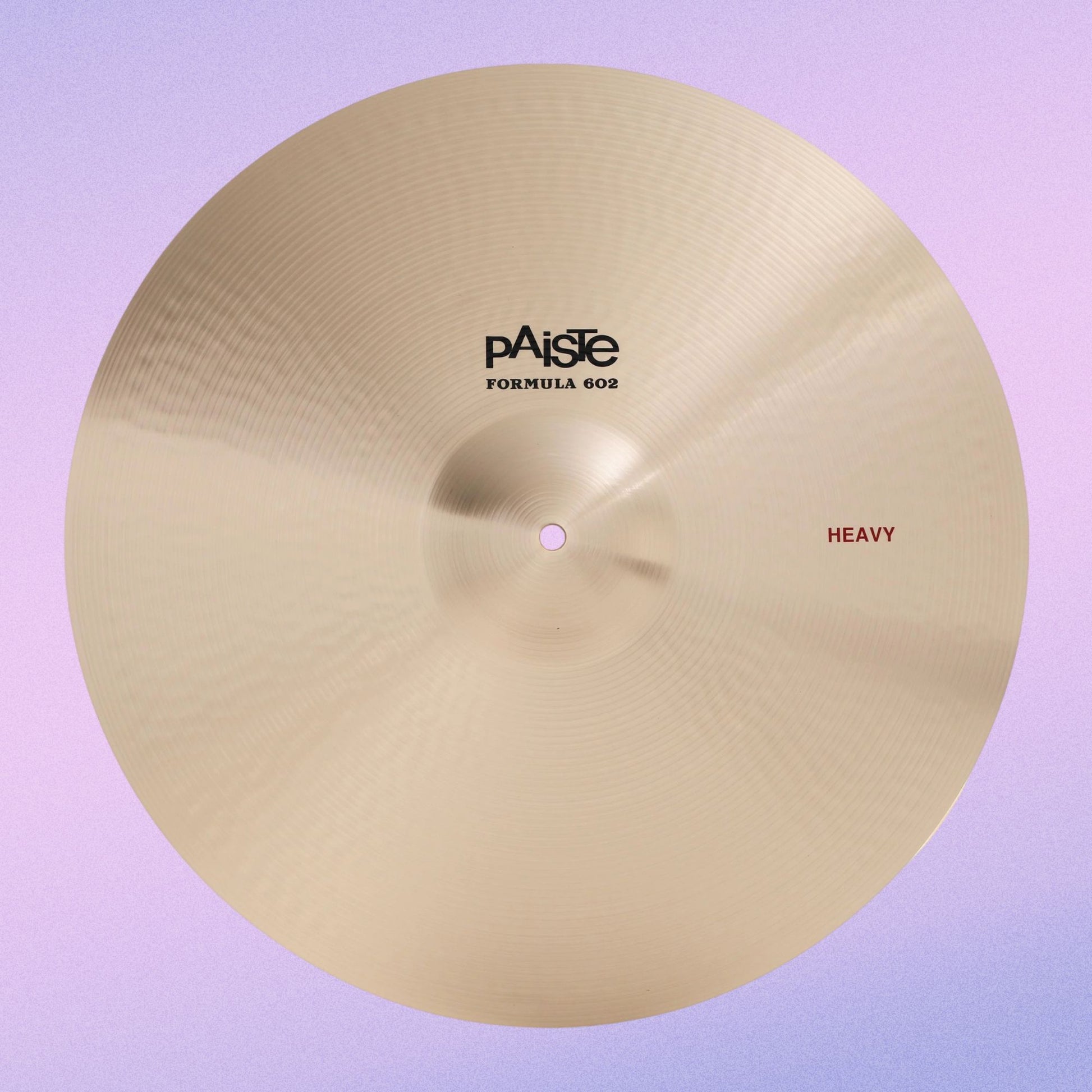Front view of Paiste 20" Formula 602 Heavy Cymbal on purple background