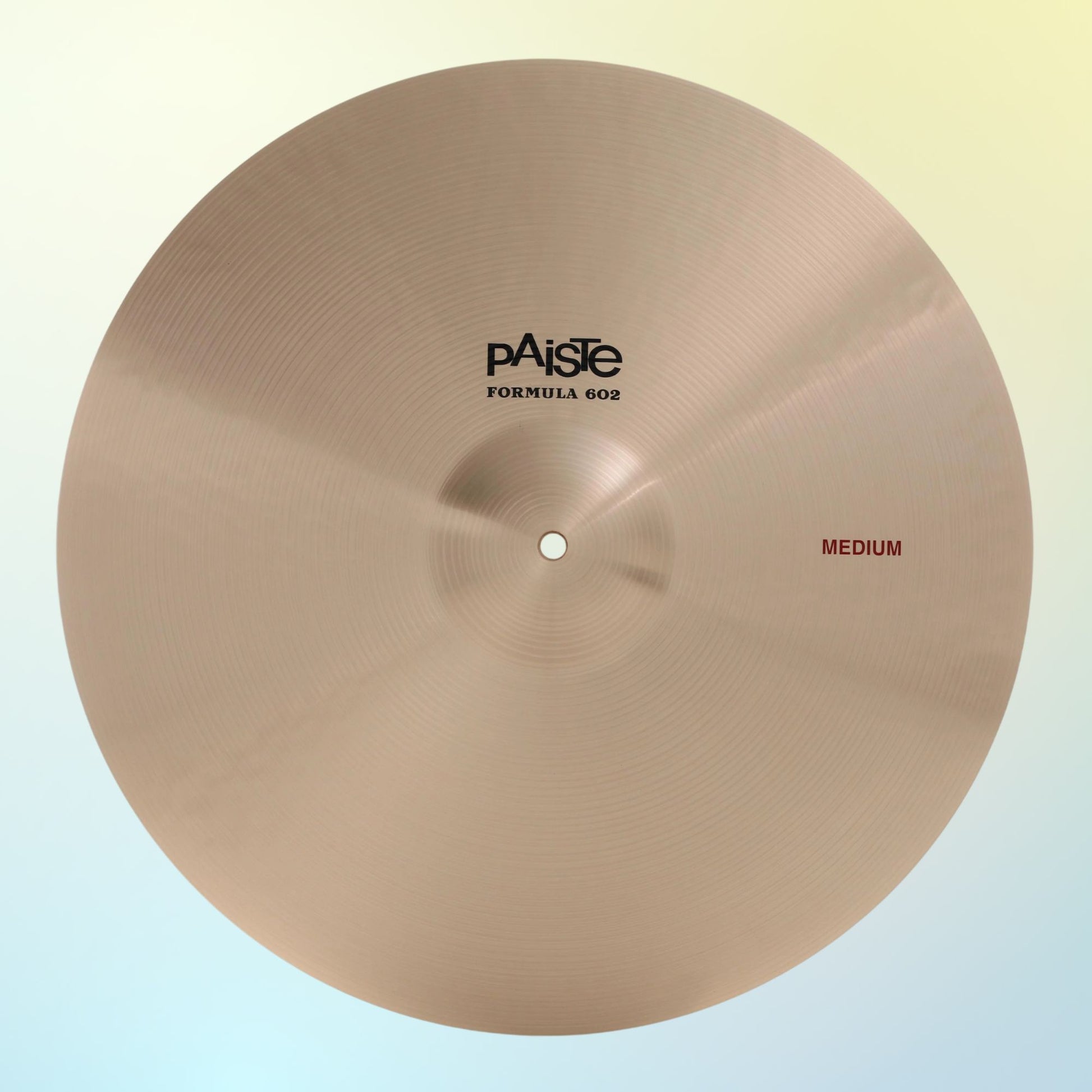 Front view of Paiste 20" Formula 602 Medium Cymbal on multicolored background