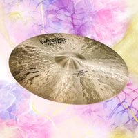 Angled view of Paiste 20" Masters Dark Crash Ride Cymbal on multicolored background