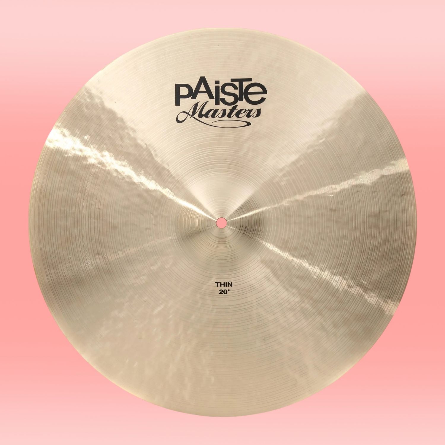 Front view of Paiste 20" Masters Thin Cymbal on pink background