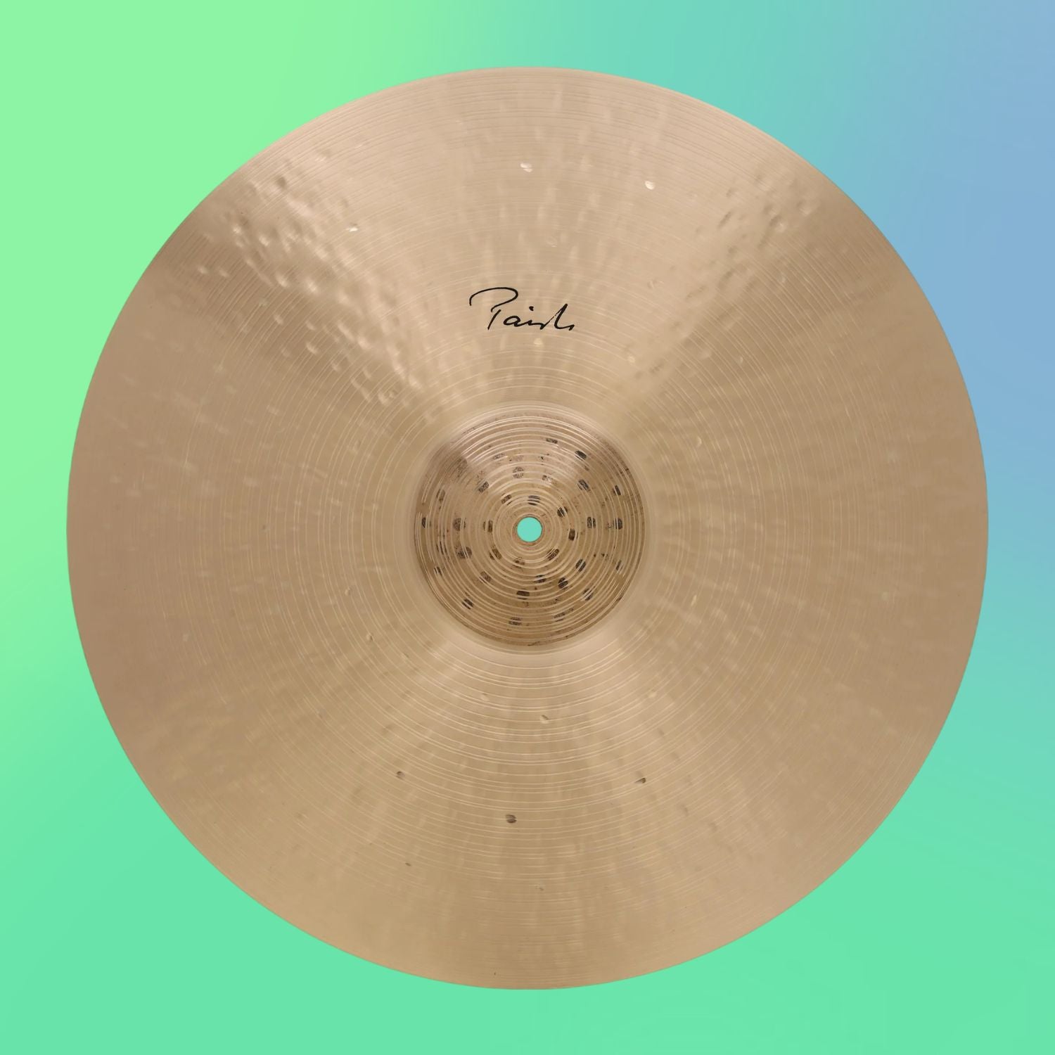 Front view of Paiste 20" Signature Traditionals Light Ride Cymbal on green and blue gradient background