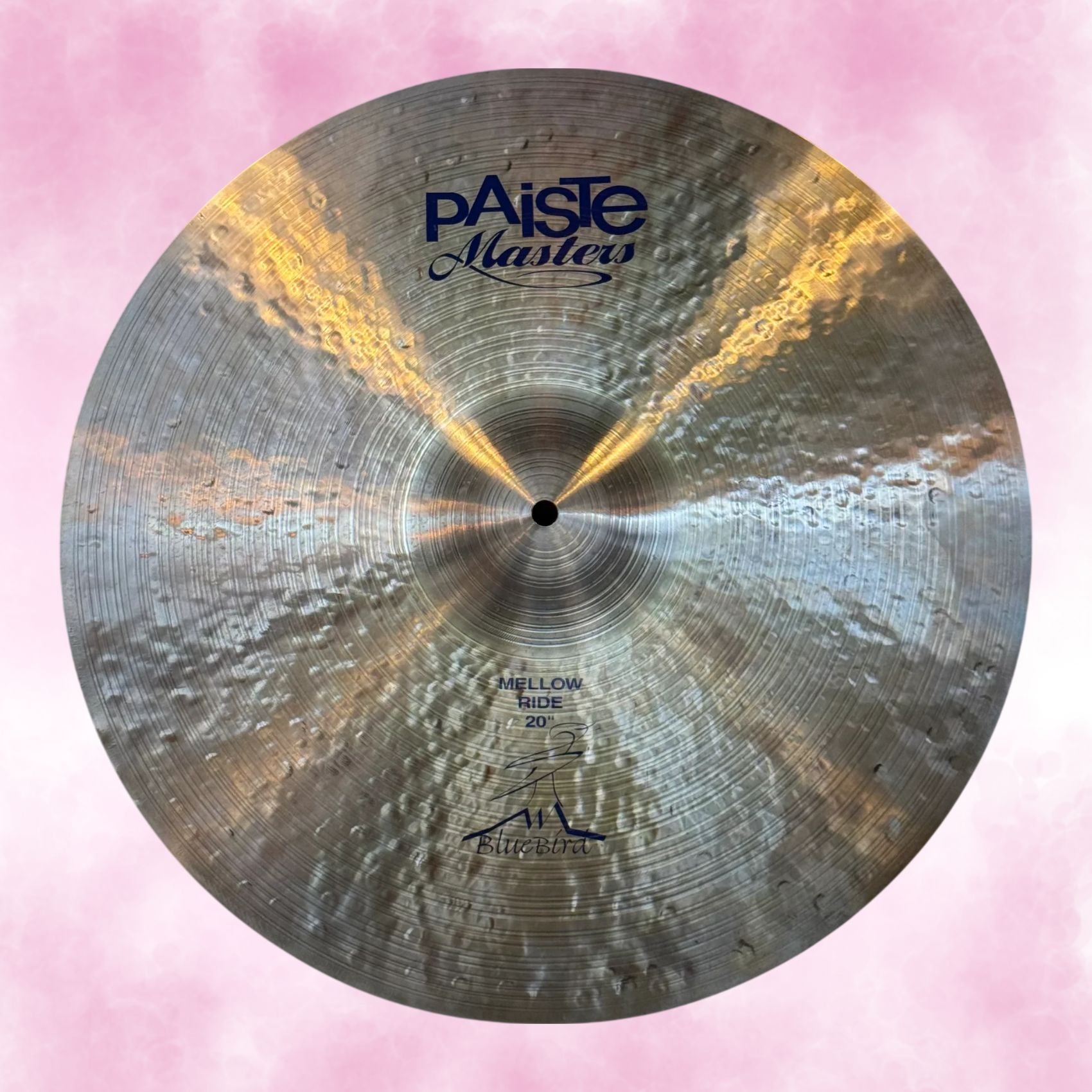 Front view of Paiste 20" Masters Mellow Ride Cymbal on pink background 
