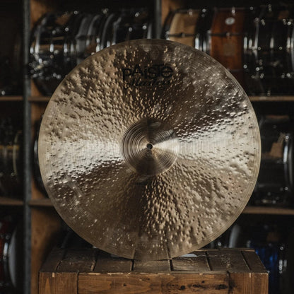 Front view of Paiste 21" Masters Medium Ride Cymbal on wooden crate in studio