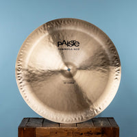 Front view of Paiste 22" Formula 602 Modern Essentials China Cymbal on crate with blue background