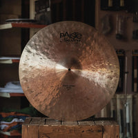 Front view of Paiste 22" Masters Dark Crisp Ride Cymbal on wooden crate in studio