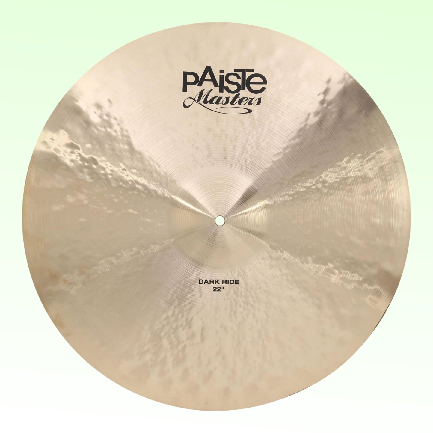 Front view of Paiste 22" Masters Dark Ride Cymbal on green background