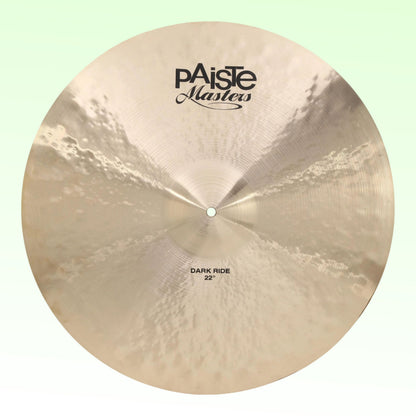 Front view of Paiste 22" Masters Dark Ride Cymbal on green background