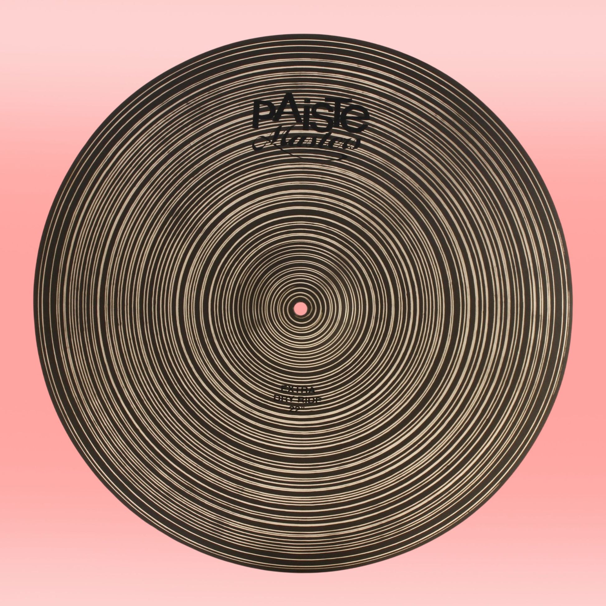 Front view of Paiste 22" Masters Extra Dry Ride Cymbal on pink background