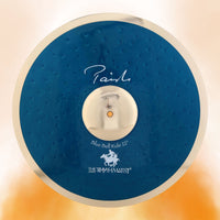 Front view of Paiste 22" Signature Blue Bell Ride Cymbal on orange background