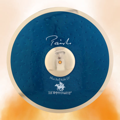 Front view of Paiste 22" Signature Blue Bell Ride Cymbal on orange background