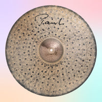 Front view of Paiste 22" Signature Dark Energy Ride Mark I Cymbal on multicolored background