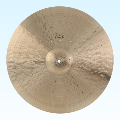 Front view of Paiste 22" Signature Traditionals Light Ride Cymbal on blue background