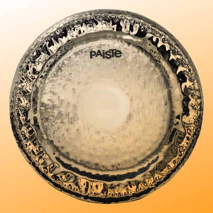 Front view of Paiste 28" Symphonic Gong Brilliant on orange bacground