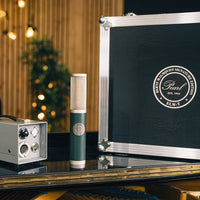 Pearl Microphone Labs ELM-T Single with case and power supply on desk inside studio