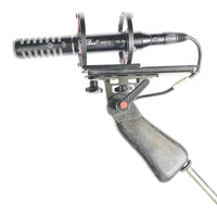 Side view of Pearl Microphone Labs MSH 10 on mount with white background