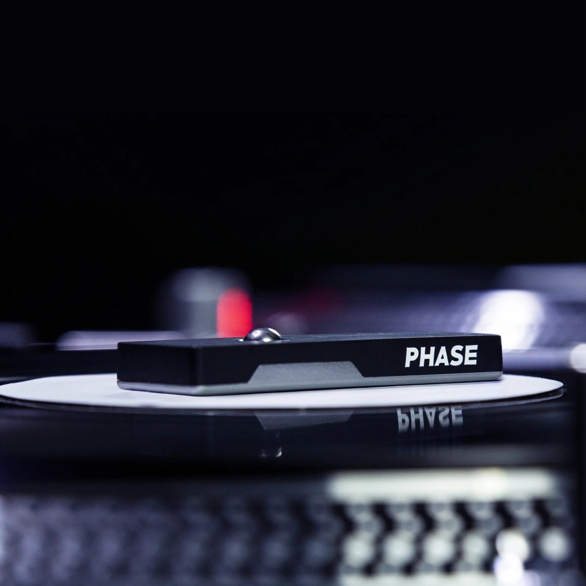 Phase Remote mounted on vinyl record in studio