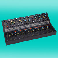 Angled view of Pittsburgh Modular Voltage Lab 2 on turquoise background