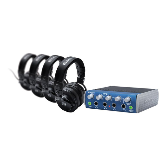 Set of headphones and audio interface on a white background