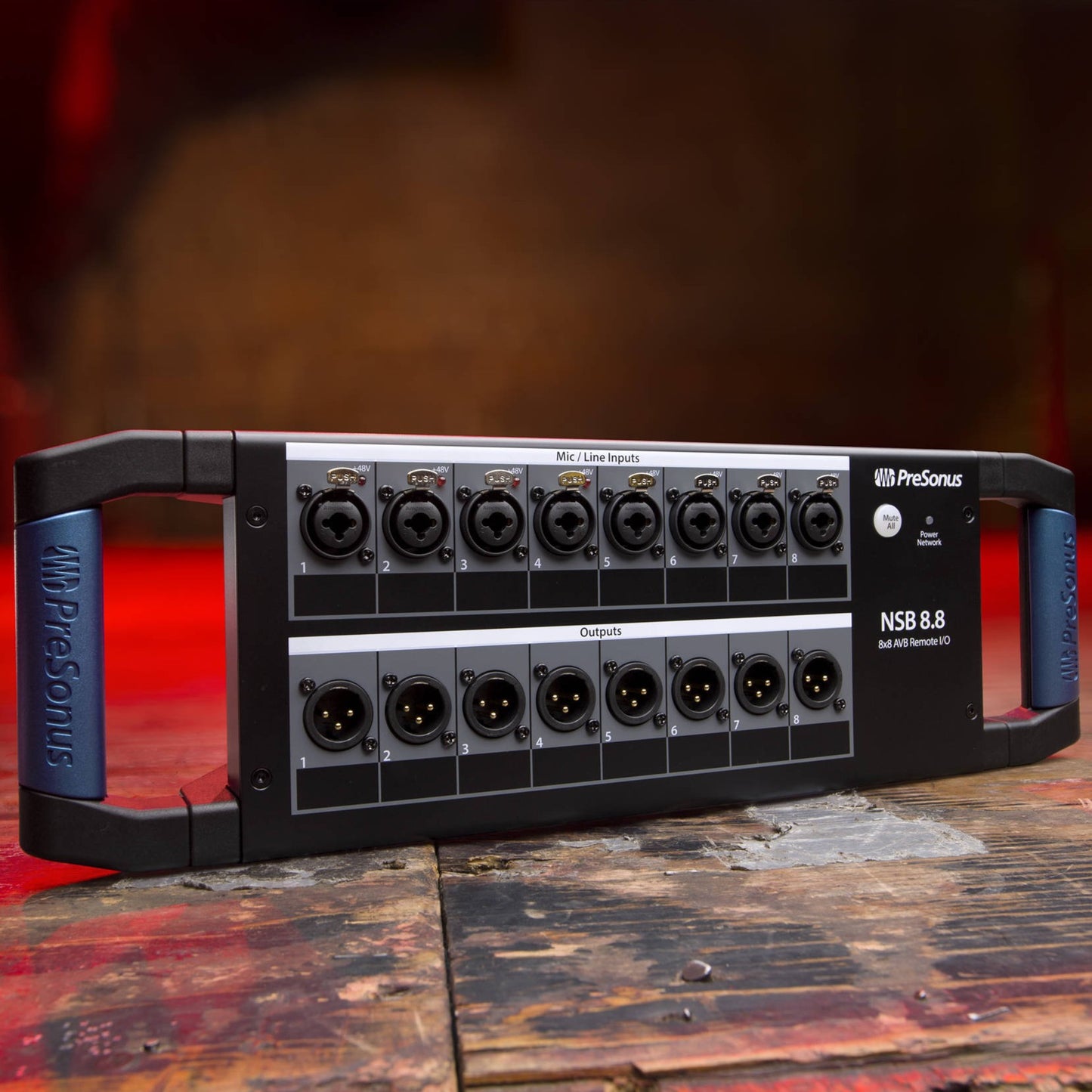 Angled front ports view of PreSonus NSB 8.8 8x8 AVB-Networked Stage Box on wooden surface in studio