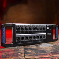 Angled front ports view of PreSonus NSB 8.8 8x8 AVB-Networked Stage Box on wooden surface in studio
