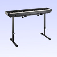 Angled front view of Profile KB-STAND Fully Adjustable Keyboard Stand Black with keyboard on top on purple background