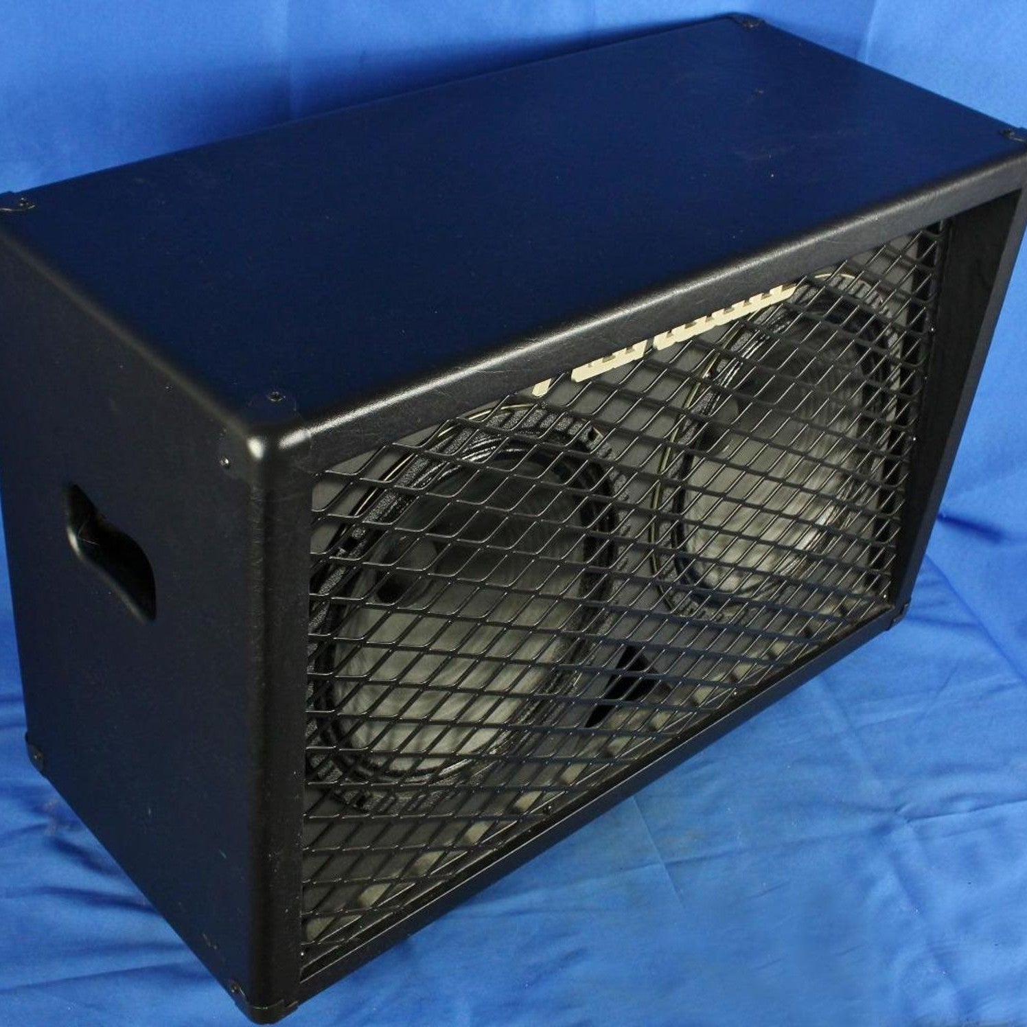 Angled view of Randall RD212-V30 Guitar Speaker Cabinet on blue cloth background