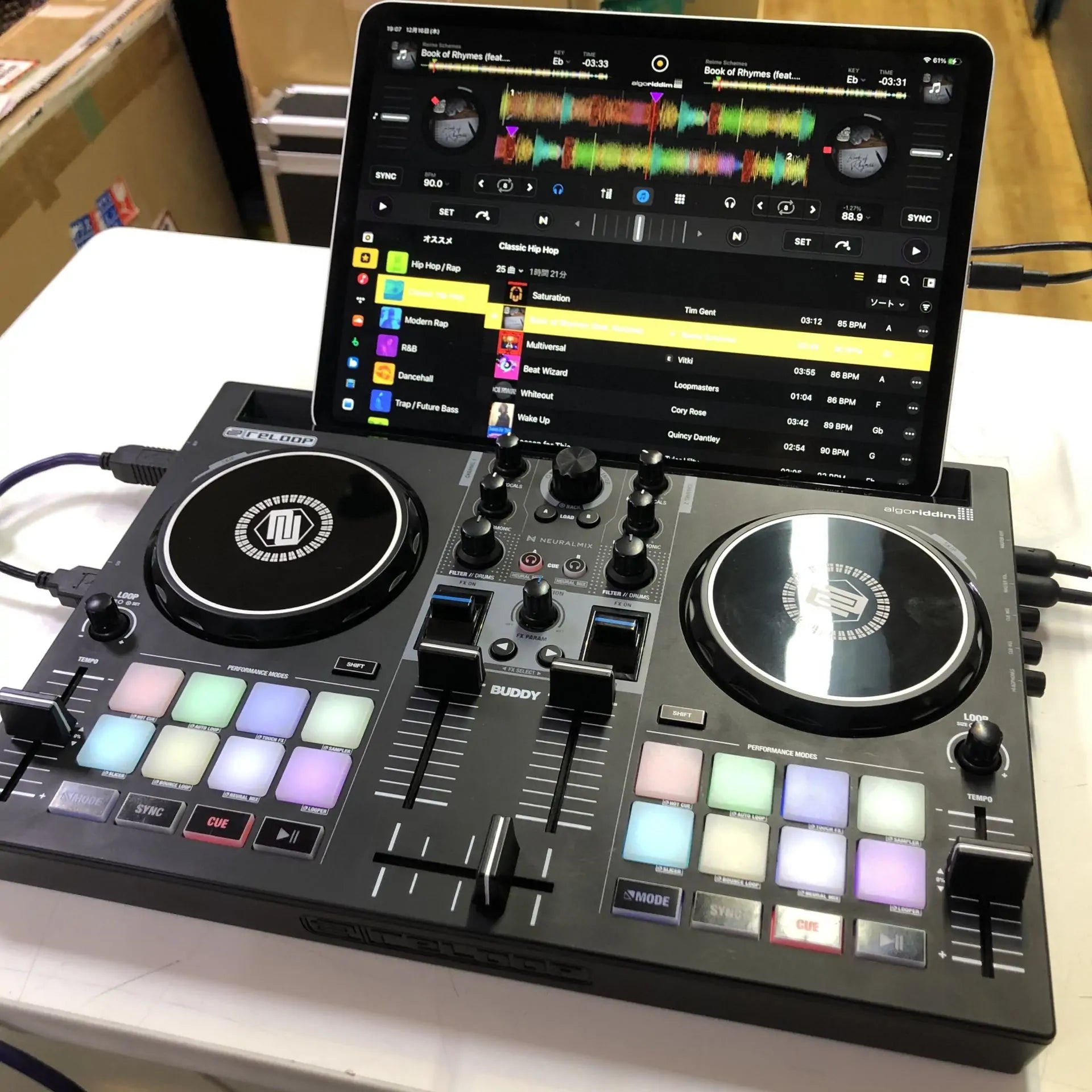 Angled view of Reloop Buddy Compact 2-Deck DJ Controller with iPad mounted
