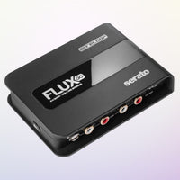 Angled view of Reloop Flux Go USB-C DVS Interface for Serato DJ Pro on purple gradient background