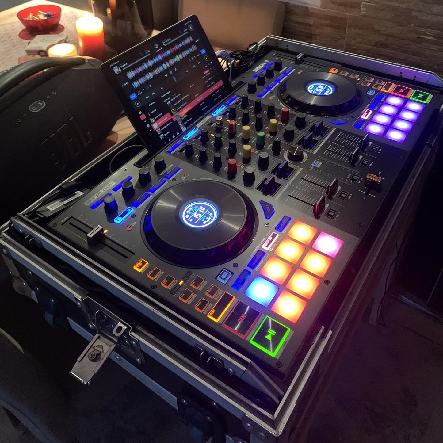 iPad mounted on Reloop Mixon 8 Pro DJ Controller in flight case in venue