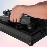 Person putting turntable inside Reloop Premium RP-7 Turntable Case on pink and purple background
