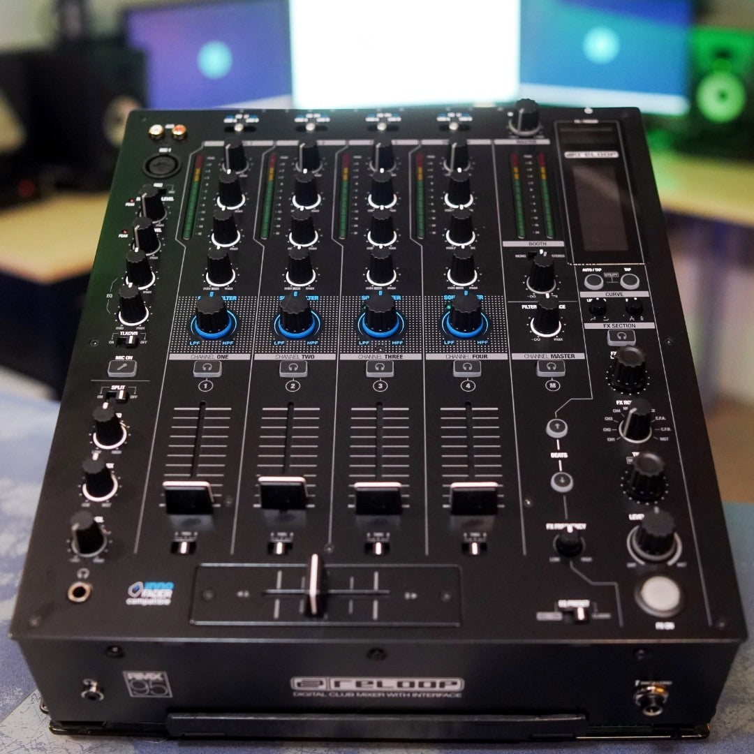 Angled front view of Reloop RMX-95 Digital Club Mixer in studio